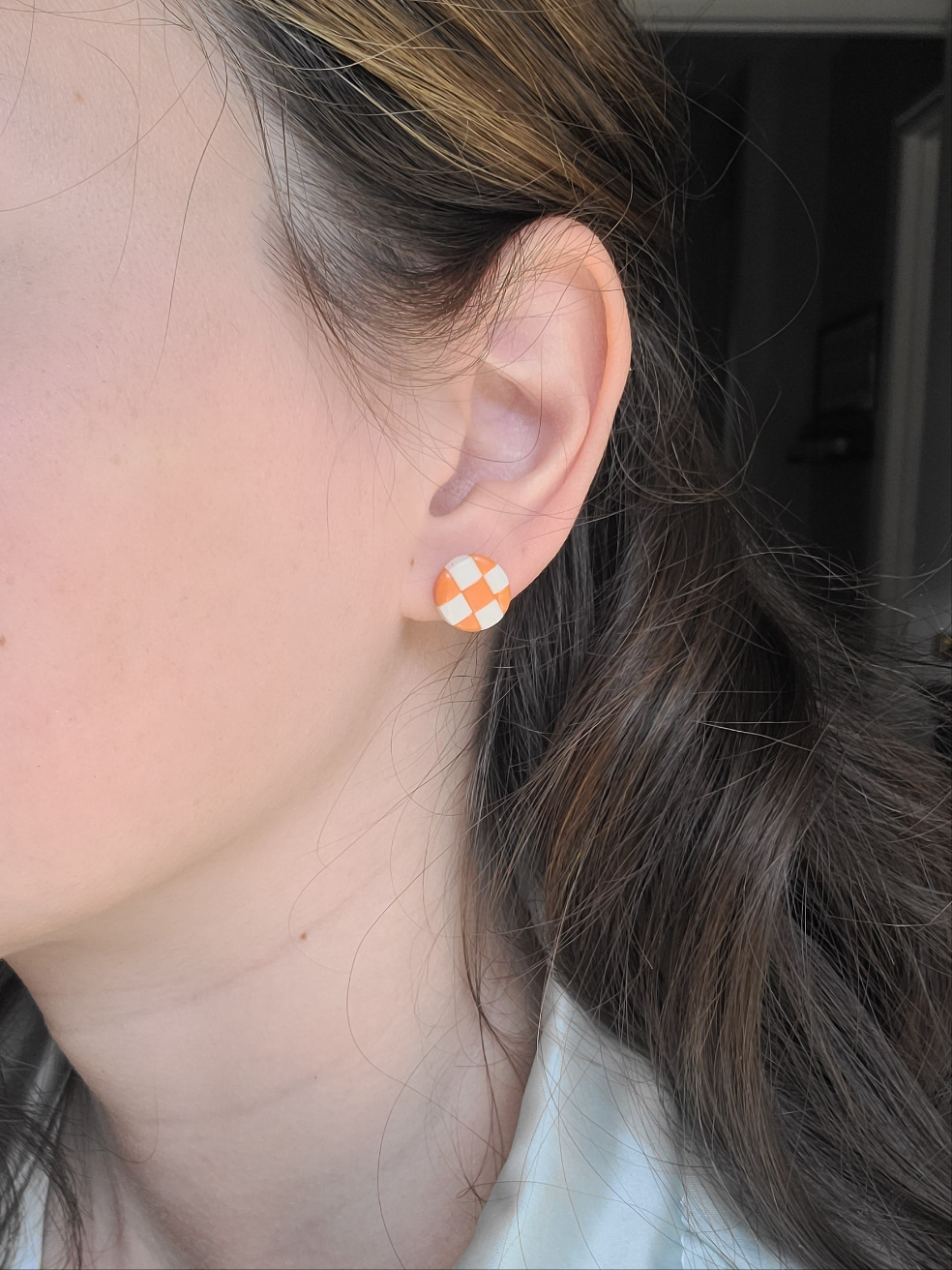 Orange and white checkered studs