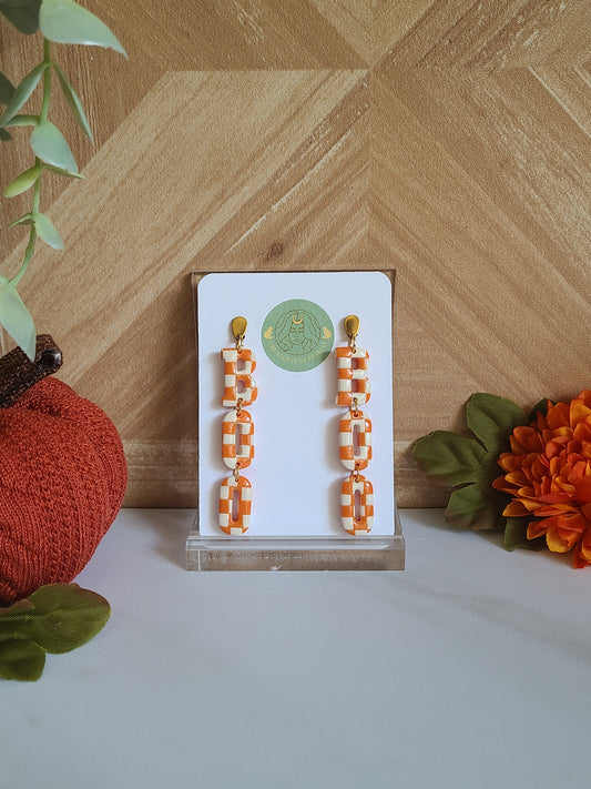 Orange and White "Boo" checkered Dangles